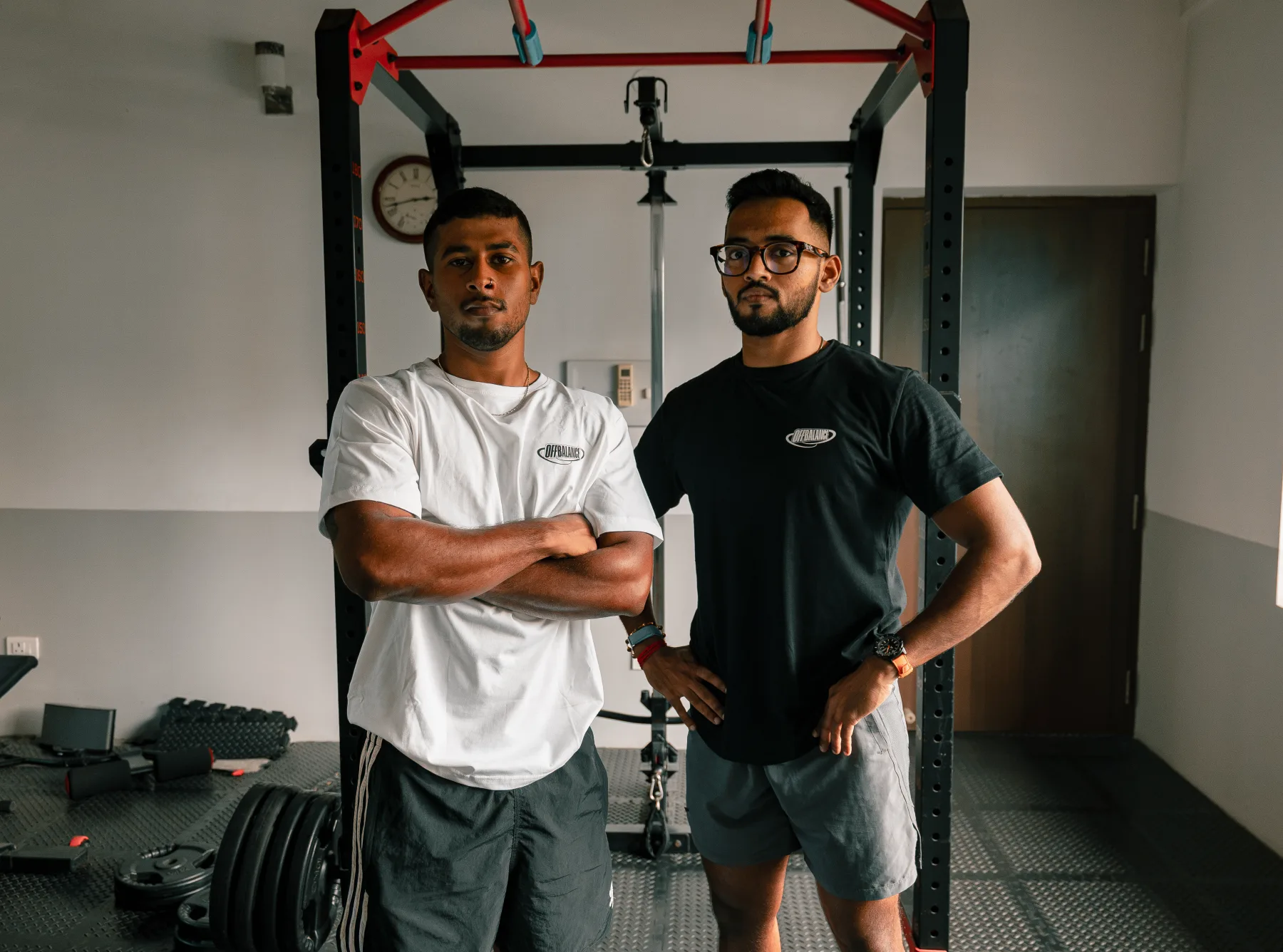 CJ and Achuthan standing together in the Off Balance training space